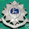 Bedfordshire & Hertfordshire Regiment cap badge, white metal