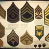 Uniforms and insignia of the Civil Air Patrol, the U.S.Army, collections of ribbons, chevrons and navy rates.  img40086